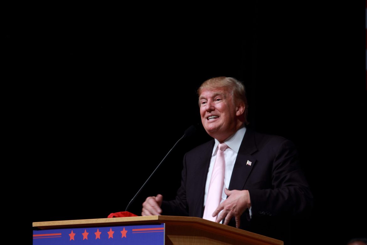 Former US president Donald Trump has survived what the Federal Bureau of Investigation (FBI) called an apparent assassination attempt at his Florida gold club on Sunday. 
The incident marks the second time in two months that Trump’s life has been reportedly targeted, raising questions about the security measures surrounding the former president.
The FBI has launched an investigation into the incident. Trump, who was playing golf at the time, was unharmed, according to a statement from his campaign. 
Secret Service engages armed suspect
The Palm Beach County Sheriff’s Office responded to reports of shots fired by Secret Service agents, who had spotted a man with a rifle near the perimeter of the Trump International Golf Club in West Palm Beach.
Palm Beach County Sheriff Ric Bradshaw explained that the Secret Service opened fire after an agent noticed a rifle barrel sticking out from the bushes near the fence line of the golf course. 
The agent, part of a team that stays ahead of Trump during his rounds, saw the weapon around 1:30 PM ET.
“The person was 300 to 500 yards away from Trump,” Bradshaw said. Secret Service personnel immediately engaged the suspect, who was later identified as 36-year-old Ryan Wesley Routh. 
The individual was detained by the Martin County Sheriff’s Office, which is located north of Palm Beach.
David Aronberg, State Attorney for Palm Beach County, noted that Routh remained silent upon his arrest. 
“He knew enough to stay silent. He did not speak to officers, but remained calm, as though he had experience dealing with law enforcement,” Aronberg told CNN.
Suspect identified as Ryan Wesley Routh
According to law enforcement sources cited by CNN, Routh, a self-employed affordable housing builder from Hawaii, has a history of political engagement. 
His social media activity reveals a mix of criticism toward Trump and strong support for Ukraine. 
Following Russia’s invasion of Ukraine, Routh traveled to Kyiv, where he attended rallies and showed support for Ukrainian troops.
The FBI’s investigation has expanded globally to uncover more about Routh’s background, including his online activity, some of which involves platforms based outside the US.
Authorities recovered an AK-47-style rifle, two backpacks containing ceramic tile, and a GoPro camera from the scene.
Trump reassures supporters of his safety
Trump was playing golf at the time of the incident, moving between the fifth and sixth holes, when the rifle was spotted by Secret Service. 
Trump later reassured his supporters, saying, 
<blockquote>
“There were gunshots in my vicinity, but before rumors start spiraling out of control, I wanted you to hear this first: I AM SAFE AND WELL!”
</blockquote>
The FBI’s investigation into the assassination attempt continues, with Secret Service agents working closely with law enforcement. 
Meanwhile, Florida Governor Ron DeSantis announced that his state will conduct its own investigation into the incident. 
The congressional task force investigating the first assassination attempt is also seeking a briefing with the Secret Service.
Rafael Barros, the Secret Service special agent in charge of the Miami field office, assured the public that Trump is safe. 
“US Secret Service personnel opened fire on a gunman located near the property line,” Barros said in a statement.
Biden and Harris express concern
Following the incident, both president Joe Biden and vice president Kamala Harris were briefed on the security breach. 
Biden released a statement expressing relief that Trump was unharmed. Biden said,
<blockquote>
“As I have said many times, there is no place for political violence or for any violence ever in our country.”
</blockquote>
He pledged that the Secret Service would continue to have every resource necessary to protect the former president.
Vice President Harris echoed Biden’s sentiments, adding, 
<blockquote>
“I am deeply disturbed by the possible assassination attempt of former President Trump today. We must all do our part to ensure that this incident does not lead to more violence.”
</blockquote>
Suspect’s past raises questions
As the investigation progresses, Routh’s background and activities have attracted significant attention. 
His apparent support for Ukraine and anti-Trump political views have raised questions about the motivations behind the attempted assassination.
Routh was detained thanks to a witness who reported seeing him flee the scene in a black Nissan. 
The witness provided law enforcement with a photograph of the vehicle and its license plate, aiding in the quick apprehension of the suspect.
Sheriff Bradshaw praised the witness’s actions, stating, “We are able to catch a witness that came to us and said, ‘Hey, I saw the guy running out of the bushes, he jumped into a black Nissan, and I took a picture of the vehicle and the tag,’ which was great.”
As investigators delve deeper into the case, the FBI’s global efforts may reveal more about the factors behind the plot against Trump’s life. 
The heightened security measures following this latest incident underscore the continuing threats faced by the former president, even as he moves through daily activities like a round of golf.
The post <a href="https://invezz.com/news/2024/09/16/trump-unharmed-in-apparent-assassination-attempt-at-florida-golf-club/">Trump unharmed in apparent assassination attempt at Florida golf club</a> appeared first on <a href="https://invezz.com/">Invezz</a> Trump unharmed in apparent assassination attempt at Florida golf club