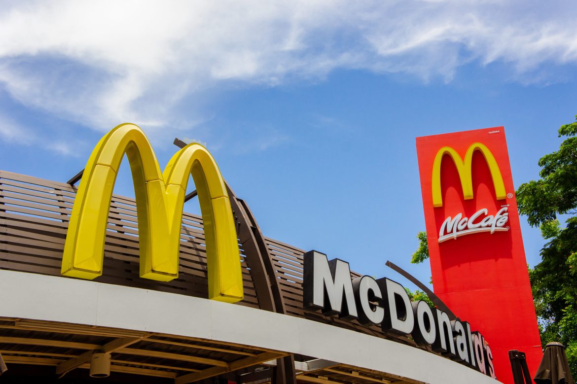 McDonald’s is preparing to reveal its third-quarter earnings this Tuesday, with analysts expecting mixed results as the chain faces ongoing challenges. 
In light of a recent <a href="https://invezz.com/news/2024/10/23/mcdonalds-e-coli-crisis-the-bacteria-has-a-history-of-taking-down-restaurant-sales-and-shares/">E. coli outbreak linked to its Quarter Pounder burger</a>, McDonald’s sales have been impacted by a temporary pullback in some locations across the US.
The Centres for Disease Control and Prevention (CDC) recently identified slivered onions as a potential culprit in the outbreak, though the chain’s fresh beef patties have been cleared. 
McDonald’s has been combating consumer spending slowdowns worldwide, intensified by inflationary pressures, with analysts forecasting only modest gains in its domestic sales. 
Here’s what to expect from the fast-food giant’s upcoming report.
Analysts’ expectations for Q3 earnings
Earnings per share (EPS): Analysts surveyed by LSEG anticipate an EPS of $3.20, reflecting McDonald’s steady margins despite the outbreak.
Revenue forecast: Revenue is projected to reach $6.82 billion, supported by sales growth initiatives, particularly in the US market.
In the US, McDonald’s has been deploying strategies to attract value-conscious consumers by introducing $5 combo meals, launched in June. 
This move is expected to drive a 0.5% same-store sales increase in its domestic market, compensating slightly for declining demand abroad.
StreetAccount estimates indicate a 0.6% overall decline in same-store sales due to weaker international demand, especially in Europe and Asia, where inflationary pressures have impacted discretionary spending.
E. coli outbreak update: onion supply under scrutiny
McDonald’s temporarily removed the Quarter Pounder from affected outlets after the CDC linked the E. coli outbreak to slivered onions. 
Health authorities have ruled out fresh beef patties as the source, yet the incident, which affected 75 individuals and resulted in one fatality, has negatively influenced consumer confidence and sales.
<a href="https://invezz.com/news/2024/10/28/mcdonalds-tests-show-e-coli-outbreak-not-linked-to-beef-patties/">McDonald’s has now reintroduced the item</a>, albeit without onions, hoping to reassure consumers and restore traffic in impacted regions.
Shares of McDonald’s have dropped by 6% since news of the outbreak, remaining flat for the year amidst ongoing operational challenges. 
With a market cap of around $210 billion, the fast-food chain’s performance reflects investors’ cautious outlook amid broader economic uncertainties.
McDonald’s response to inflationary pressures has focused on value offerings, especially in high-inflation markets like the US, where consumers are favoring lower-priced meals. 
The value-driven menu initiative could help counteract weakened demand globally, as inflation pushes consumers to seek affordable options when dining out.
The post <a href="https://invezz.com/news/2024/10/29/mcdonalds-q3-earnings-today-will-e-coli-crisis-impact-revenue-outlook/">McDonald’s Q3 earnings today: will E. coli crisis impact revenue outlook?</a> appeared first on <a href="https://invezz.com/">Invezz</a> McDonald’s Q3 earnings today: will E. coli crisis impact revenue outlook?