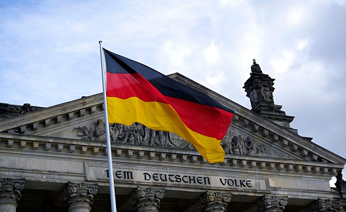 Germany’s economy, which is considered the heart of Europe, is showing troubling signs of decline. 
Once celebrated for its resilience, Germany’s economy now stands out as the slowest-growing among the G7 and Eurozone countries. 
Recent IMF forecasts show a projected 0.2% contraction in 2024 and only 0.8% growth in 2025—far from the robust expansion once associated with Europe’s industrial leader. 
A budget gap exceeding €40 billion, combined with plummeting tax revenues expected to fall short by €60 billion over the next five years, paints a picture of a country in economic gridlock. 
And as both small businesses and corporate giants tighten their belts, some are wondering if Germany is on the verge of a “lost decade.”
The costs of Germany’s dependence
For decades, Germany’s success rested on its ability to supply high-quality goods worldwide, especially to markets like China. 
Exports account for nearly half of Germany’s GDP, much higher than other major economies, making the country vulnerable when demand falls. 
Today, German exports to China are faltering, particularly in the automotive and machinery sectors. 
Companies like Deguma, which produces industrial machinery, are struggling with clients delaying orders, citing economic uncertainty and wavering demand.
This export slump has exposed the risks of an economy heavily reliant on external markets. 
And as China increasingly shifts to local suppliers and global trade slows, Germany’s overdependence on exports could spell trouble for long-term growth. 
Already, the German government has had to adjust its tax projections downward, signaling just how widespread these economic pressures are becoming.
The Green Dream, at a high price
Germany’s ambitious <em>Energiewende</em>, or “energy transition,” was meant to position the country as a leader in climate initiatives, pushing for renewable energy adoption.
By 2025, subsidies for renewables are projected to hit €18 billion, marking a substantial financial commitment. 
Yet the transition has come at a high cost for German industry. For smaller companies in particular, absorbing these energy expenses has proven challenging.
Germany’s reliance on Russian energy—made starkly evident when supply disruptions spiked costs following the 2022 Ukraine invasion—has further complicated the shift to renewables. 
While the government aims to make Germany’s economy climate-neutral, critics argue that the rapid focus on green energy is driving up operational costs and undercutting competitiveness, especially among traditional industries that rely on affordable power.
At the same time, Germany’s decision to phase out nuclear power after the 2011 Fukushima disaster has left the country more exposed to energy price fluctuations. 
For now, businesses are bearing the brunt of rising costs and an uncertain energy landscape that has yet to stabilize. 
Some German businesses are adapting to the country’s green shift, seeing an opportunity in the push for sustainable solutions. 
GNV, a company producing geothermal components, reported a 400% surge in orders this year as demand for climate-friendly technology rises. 
By expanding its workforce and increasing production, GNV and similar firms are positioning themselves within Germany’s emerging green economy.
These successes show a potential way forward, though they represent only a fraction of the country’s most prominent businesses.
Political divisions are stalling economic action
Germany’s economic challenges are compounded by political gridlock, as the coalition government led by Chancellor Olaf Scholz struggles to agree on key policies. 
The coalition, an unusual alliance of Social Democrats, Greens, and Liberals, often clashes over issues like climate regulations, industrial policy, and economic reform, leaving business leaders frustrated by delays and indecision.
This discord has had a tangible impact on the economy. 
A recent survey revealed that nearly 37% of German companies are now considering cutting production or moving operations abroad, up from 31% the previous year.
The Green Party’s strong stance on climate policies has created tension within the coalition, drawing criticism from businesses and local leaders alike. 
In regions like Thuringia, business owners blame the increase in regulatory burdens for stifling growth, while bureaucratic hurdles and high taxes have further dampened business confidence. 
This political impasse, combined with an aging infrastructure, is increasingly seen as a barrier to the structural reforms Germany needs to stay competitive.
Germany’s automotive industry is on the edge
As one of the largest contributors to the country’s GDP, Germany’s automotive sector is now struggling with rising costs, declining demand for electric vehicles, and fierce competition from Chinese manufacturers offering affordable EVs.
Volkswagen recently announced its first factory closures in Germany, a historic move that reflects the broader downturn in the automotive industry. 
Companies like BMW and Mercedes-Benz have lowered profit forecasts, citing weaker demand, especially in China—a market that once accounted for a significant share of their sales. 
The ripple effects are being felt across the industry, impacting the numerous suppliers and small businesses that support Germany’s car manufacturers.
This shift has left some automakers scrambling to adjust. Volkswagen, for instance, has committed to cost-cutting measures, including layoffs and potential production cuts, to stay competitive. 
But as job losses increase and supply chains weaken, the industry’s downturn is beginning to show up in Germany’s employment statistics. 
The situation is a warning sign for the country’s economic future, given the automotive sector’s importance to Germany’s industrial identity and broader economy.
Can Germany reclaim its economic resilience?
Germany’s outlook has become a focal point of mixed perspectives, with recent reports offering both optimism and caution. 
A <a href="https://www.bloomberg.com/news/articles/2024-10-25/germany-s-business-outlook-improves-as-economy-stabilizes?embedded-checkout=true">recent Bloomberg report</a> suggests that Germany’s economic downturn “may be ending,” with a slight improvement in business confidence. 
The Ifo expectations index, which rose in October, hints at potential stabilization as sectors like tourism and IT show growth. 
For the services sector, which has seen gains amid manufacturing struggles, the latest data offers a glimmer of hope.
Yet, most economists are still not convinced, arguing that this optimism may be premature. 
Germany’s industrial base is still in a precarious position. Despite some positive readings, the broader economic data reveals deep-seated issues that continue to drag on growth. 
With a five-year tax revenue shortfall projected at €60 billion and a budget gap of over €40 billion, Germany’s financial outlook suggests economic gridlock rather than recovery. 
Most traditional industries are still grappling with rising costs, energy uncertainties, and policy obstacles. 
Experts argue that structural reforms are urgently needed to lower energy costs, streamline regulations, and rebuild Germany’s infrastructure. 
Political deadlock within the coalition government has delayed necessary reforms, and a recent survey indicates that 37% of companies are now considering relocating or cutting production due to these burdens.
One thing is certain: the pressure on Germany’s economy is more intense than ever. Its path forward will require decisive action to bridge the gap between traditional industrial strengths and the demands of a green economy. 
For now, the possibility of a lost decade becomes higher and higher as months go by, leaving Europe’s largest economy at a crossroads where each decision could define the country’s future.
The post <a href="https://invezz.com/news/2024/10/28/germanys-economy-struggles-to-recover-are-we-heading-into-a-lost-decade/">Germany’s economy struggles to recover: Are we heading into a lost decade?</a> appeared first on <a href="https://invezz.com/">Invezz</a> Germany’s economy struggles to recover: Are we heading into a lost decade?