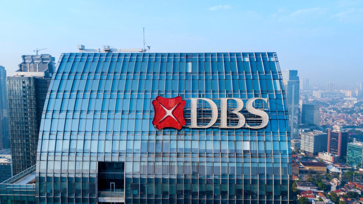 Singapore’s DBS Bank (DBSM.SI) is anticipating a boost in its 2025 profit margins, spurred by potential fiscal policies under Donald Trump’s expected presidency. 
Trump’s anticipated approach may involve reduced interest rate cuts from the US Federal Reserve, resulting in a favourable interest rate environment for DBS.
Following the bank’s latest earnings report, CEO Piyush Gupta, at briefing on Thursday, explained how potential US policies could lead to higher net interest margins, which are essential for DBS’s profitability.
DBS, the largest bank in Southeast Asia, reported an impressive net profit for Q3, reaching S$3.03 billion, a record-breaking figure that outperformed expectations of S$2.80 billion. 
Despite a slight year-on-year decrease in net interest margins, the bank saw growth across wealth management, treasury customer sales, and trading income, all contributing to its robust earnings.
Trump policies expected to drive favourable economic conditions for DBS
DBS CEO Piyush Gupta, indicated that Trump’s potential fiscal policies might create a more inflationary environment, fuelled by stricter immigration controls, higher tariffs, and increased deficit spending.
This environment could prevent the Federal Reserve from aggressively lowering interest rates, thereby keeping the interest rate environment beneficial for DBS.
With DBS’s operations extending across Asia, Gupta cautioned that the bank would remain mindful of the regulatory and legal challenges the administration might introduce. 
Yet, with higher interest rates anticipated, DBS’s financial outlook appears promising, given that the bank could benefit from increased profitability in its core market.
DBS Q3 results surpass expectations, bolstered by wealth management and trading
In the third quarter of 2024, DBS achieved a record net profit of S$3.03 billion, a 15% increase over the previous year, marking its strongest quarterly performance to date. 
This figure exceeded its previous quarterly high of S$2.96 billion, set in Q1 2024, despite a minor dip in net interest margin from 2.19% to 2.11% year-on-year.
Fee income from wealth management and strong markets trading revenue underpinned these results, underscoring DBS’s diversified revenue streams.
Over the first nine months of the year, DBS’s net profit rose by 11% to reach S$8.79 billion, a new high for the bank. 
Return on equity also improved, growing from 18.6% to 18.8%, a sign of DBS’s successful strategies in an evolving economic landscape.
DBS’s positive performance boosted investor confidence, driving its shares up by 6.9% to an all-time high of S$41.87. 
Competitors Oversea-Chinese Banking Corporation (OCBC.SI) and United Overseas Bank (UOBH.SI) also saw gains of 3.5% and 2.3%, respectively, with the local stock index (.STI) rising by 1.8%.
While DBS is poised for growth under anticipated US fiscal policies, it faces regulatory changes in Singapore. 
A global minimum corporate tax rate set by the Singapore government is projected to moderate DBS’s 2025 profit outlook, as the tax measure will impact profitability within the region.
The bank’s strong Q3 performance and optimistic forecast suggest that DBS is well-positioned to navigate these adjustments and continue its upward trajectory.
The post <a href="https://invezz.com/news/2024/11/07/trumps-return-boosts-2025-profit-outlook-for-singapores-dbs-bank/">Trump’s return boosts 2025 profit outlook for Singapore’s DBS Bank</a> appeared first on <a href="https://invezz.com/">Invezz</a> Trump’s return boosts 2025 profit outlook for Singapore’s DBS Bank