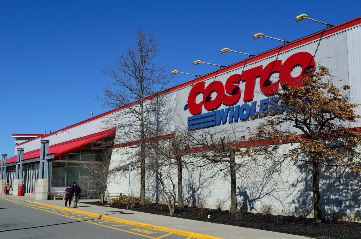 Costco Wholesale’s stock has become the Palantir Technologies of the retail world, boasting a <a href="https://invezz.com/news/2024/09/17/costco-stock-is-more-overvalued-than-nvidia-still-a-buy/">steep valuation</a> and an ardent investor base. 
The warehouse giant continues to deliver value to its 77 million members worldwide with unbeatable deals like $4.99 rotisserie chickens and a $1.50 hot dog and soda combo—unchanged for 40 years. 
This loyalty has propelled the company’s stock nearly 600-fold since its 1985 IPO. 
However, its current valuation <a href="https://invezz.com/news/2024/12/07/costco-stock-price-forms-risky-patterns-is-the-bubble-about-to-pop/">raises critical questions for investors</a>.
Costco’s shares have surged 45% in 2024, reaching $962 and trading at 53 times forward earnings—levels only rivalled by Tesla among the S&P 500’s top 20 companies. 
Yet, analysts warn in a <a href="https://www.barrons.com/articles/sell-costco-stock-price-59dec6a2">Barron’s report</a> that such lofty multiples may not align with Costco’s projected growth, which is expected to average 10% annually in earnings per share over the coming years.
Bull case for COST and merits of its business model
Despite valuation concerns, Costco’s model remains a favourite among analysts and consumers alike. 
Costco’s revenue is expected to rise by 7% in the current fiscal year, following a similar gain in 2024. 
Same-store sales have grown between 5% and 6% annually over the past two years. 
Additionally, Costco’s nearly 900 stores—616 in the US—are expanding by 25 to 30 annually, reflecting strong demand for its value-oriented approach.
JPMorgan analyst Christopher Horvers praises Costco’s international expansion, noting its success in every country it has entered.
Approximately a third of its stores are overseas, and new locations often draw long lines, demonstrating the brand’s universal appeal.
<em>Source: <a href="https://www.barrons.com/articles/sell-costco-stock-price-59dec6a2">Barron’s</a></em>
Morgan Stanley’s Simeon Gutman shares this optimism, forecasting accelerated profit growth. 
He maintains an Overweight rating with a $1,150 price target, implying nearly 20% upside from current levels.
Membership fees play a pivotal role in Costco’s success, accounting for about half of its operating profits. 
A $5 increase in the annual membership fee to $65 in September 2024—the first hike in seven years—further underscores its resilience. 
Notably, nearly half of members opt for the $130 Executive Membership.
These fees, with renewal rates exceeding 90%, provide a steady income stream, giving Costco a <em>Netflix</em>-like appeal, and justify the outsize P/E multiple the company enjoys, bulls say. 
Costco’s high valuation difficult to justify, analysts suggest caution
Brian Yarbrough, a retail analyst at Edward Jones, highlights that Costco was valued at 40 times forward earnings at the beginning of 2024 and 30 times prior to the Covid-19 pandemic. 
This suggests the stock might lose momentum as earnings align with its current price—or potentially decline by 15% to 20% in the event of a market downturn or an unforeseen profit or revenue shortfall. 
He says,
<blockquote>
Costco is one of the highest-quality retailers in the industry, but it’s extremely difficult to justify the valuation of the stock.
</blockquote>
If the stock reverts to a more modest valuation of 40 times projected 2025 earnings, its price could drop by over 20% to $725.
<em>Costco’s stock comparison with other tech giants</em>, <em>Source: <a href="https://www.barrons.com/articles/sell-costco-stock-price-59dec6a2">Barron’s</a></em>
Even among its peers, Costco appears overpriced. 
Growth stocks like Apple, Microsoft, and Nvidia trade at around 30 times forward earnings, while Walmart and Amazon hover at 35 times. 
Costco’s price-to-earnings-to-growth (PEG) ratio of five starkly contrasts with the two-to-three range seen in most growth stocks.
Trivariate Research analysts share a cautious outlook. 
Their data indicates that companies breaching a 50 P/E ratio for the first time often revert below 40 within a year, underperforming the market in the subsequent three years. They say,
<blockquote>
While we can certainly appreciate many merits of Costco’s unique business model, it strikes us as a lofty increase in valuation for a business whose top-line growth isn’t materially different than it has been historically.
</blockquote>
This view is echoed by Yarbrough, who stresses that Costco’s high-quality reputation doesn’t justify its elevated stock price. 
“It’s going to be hard for the stock to outperform over the next three to four years,” he says.
Growing pains: limited US expansion potential
While Costco continues to thrive, its growth trajectory faces challenges. 
Bill Smead, manager of the Smead Value Fund, highlights that Costco’s massive $250 billion in annual sales makes it mathematically difficult to sustain past growth rates.
The company still finds success in opening new stores in established markets, such as Pleasanton, California, and new territories like Scarborough, Maine. 
However, the runway for US expansion is narrowing.
CEO Ron Vachris remains optimistic, citing opportunities in untapped domestic and international markets, but analysts like Smead compare Costco’s current valuation to the “Nifty Fifty” stocks of the 1970s, which significantly underperformed over the following decade.
Risks of a pullback and whether you should sell the stock?
History shows that steep valuations often invite corrections, and Costco’s case is no exception. 
Analysts at Trivariate Research caution that companies with high P/E ratios frequently underperform over the long term. 
While there’s no immediate threat to Costco’s fundamentals, a broader market selloff or unexpected earnings miss could trigger a sharp decline.
Moreover, valuing membership fees separately from retail profits—a common argument among bulls—remains controversial. 
Yarbrough contends that Costco’s holistic strategy makes such distinctions impractical.Costco’s strengths are undeniable, from its membership-driven model to its unwavering commitment to value.
Its loyal customer base, low shoplifting rates, and seasoned management team are testaments to its operational excellence.
However, the stock’s valuation appears stretched, especially in the context of its modest growth projections. 
For long-term investors, the question isn’t Costco’s quality but whether its current price justifies future returns. 
With risks of a pullback looming, now might be the time for investors to reassess their positions.
The post <a href="https://invezz.com/news/2024/12/20/costco-stocks-steep-valuation-raises-concerns-is-it-time-to-sell/">Costco stock’s steep valuation raises concerns: is it time to sell?</a> appeared first on <a href="https://invezz.com/">Invezz</a> Costco stock’s steep valuation raises concerns: is it time to sell?