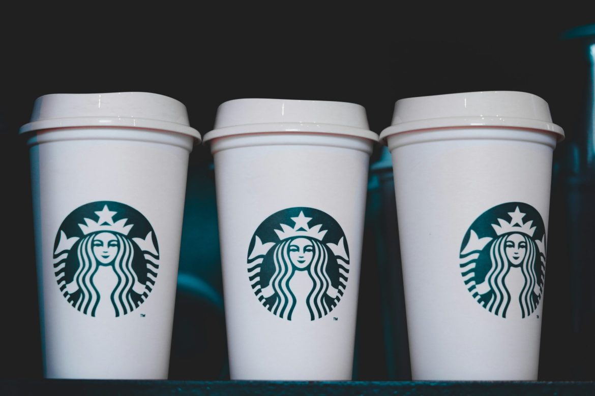 A five-day strike by Starbucks employees has escalated into the largest work stoppage in the company’s history, with over 5,000 workers from more than 300 US stores expected to join the action, as per a Reuters <a href="https://www.reuters.com/business/retail-consumer/starbucks-strike-expand-over-300-us-stores-christmas-eve-union-says-2024-12-24/">report</a>.
The walkout, led by Starbucks Workers United, has shut down 60 stores across key cities like New York, Los Angeles, and Seattle.
The protest stems from unresolved disputes over wages, staffing, and scheduling, with negotiations at a standstill. 
Workers say these issues have been brewing for years and demand that Starbucks takes immediate action.
This significant disruption is set to continue until Christmas Eve, underscoring growing tensions between the coffee giant and its unionised workforce.
Wage disputes and stalled talks trigger strike expansion
The strike comes after months of unsuccessful negotiations between Starbucks and the union. 
Workers have voiced dissatisfaction with the company’s offer of a future 1.5% wage increase, rejecting it as insufficient amidst rising living costs. 
Starbucks Workers United has criticised the coffee chain for failing to present “a serious economic proposal.”
Workers United has advocated for significant wage increases, requesting a 64% rise in minimum hourly wages immediately and a 77% increase over a three-year contract. 
In response, Starbucks has labeled these demands as “unsustainable.”
Starbucks, which operates over 10,000 stores in the US, maintains that the impact on its operations will be minimal. 
The company claims the majority of locations remain open and has reiterated its willingness to return to negotiations. 
However, the union disputes this, accusing Starbucks of ending prior bargaining sessions prematurely.
The strike also highlights broader labour challenges within the service industry, where understaffing and irregular schedules have fuelled dissatisfaction. 
For Starbucks, which prides itself on its progressive image, the strike signals a disconnect between corporate messaging and employee sentiment. 
The walkout comes at a critical time, as holiday sales often represent a significant portion of Starbucks’ annual revenue.
Major cities feel the impact as Starbucks grapples with unrest
Key locations in cities like Boston, Seattle, and Los Angeles have felt the brunt of the strike, with closures forcing customers to turn to alternative coffee options.
While Starbucks insists the disruptions are limited, the scale of the protest suggests otherwise.
This strike, described by union representatives as a “show of strength,” indicates the possibility of prolonged unrest. 
The timing, during the peak holiday season, amplifies its impact, potentially affecting Starbucks’ revenue and brand perception.
Some analysts warn that continued disputes could influence investor confidence, adding pressure on the company to address worker grievances.
Looking ahead, the outcome of this labour dispute could set a precedent for other unionised retail and service workers. 
Starbucks Workers United has stated that this strike is only the beginning, signalling a more confrontational approach to securing worker demands in 2024.
The post <a href="https://invezz.com/news/2024/12/24/starbucks-strike-to-escalate-to-300-stores-as-more-workers-plan-walk-out-on-christmas-eve/">Starbucks strike to escalate to 300 stores as more workers plan walk out on Christmas Eve</a> appeared first on <a href="https://invezz.com/">Invezz</a> Starbucks strike to escalate to 300 stores as more workers plan walk out on Christmas Eve