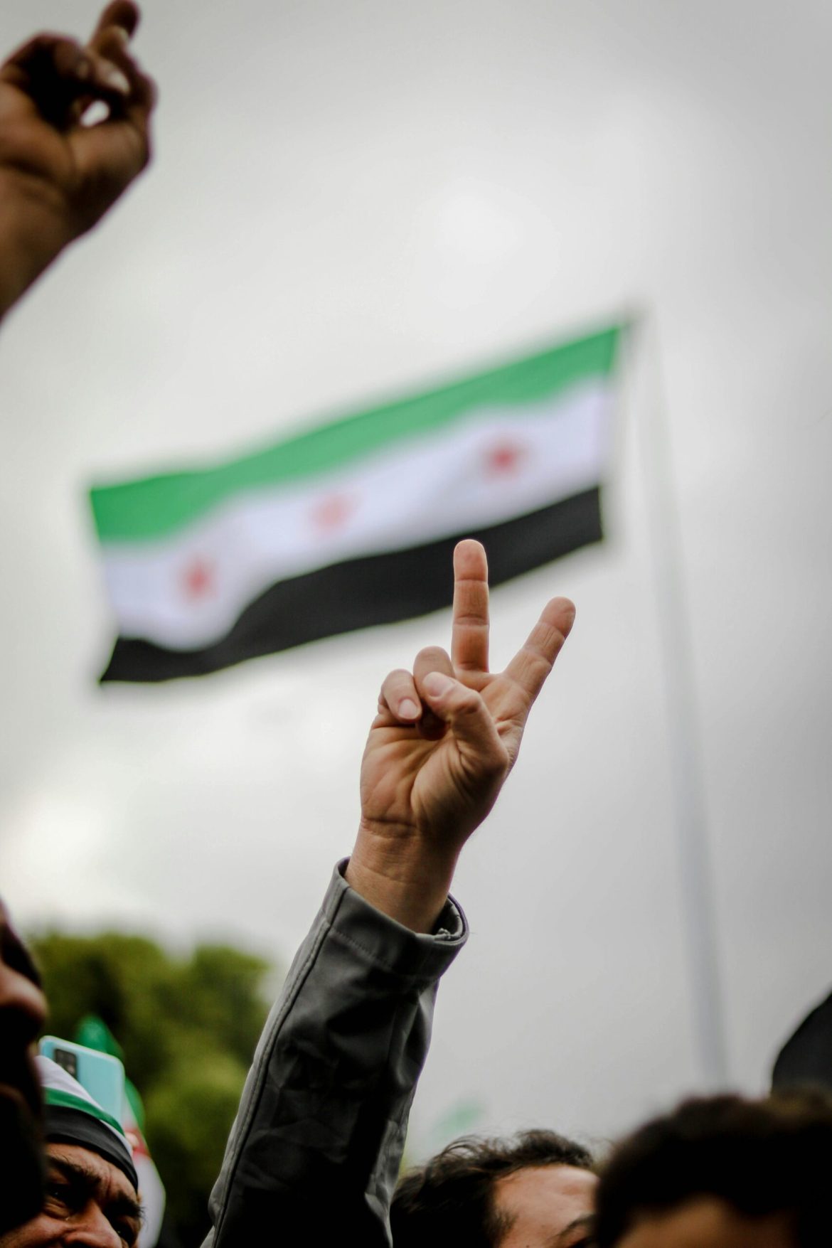 The collapse of Bashar al-Assad’s government on December 8, 2024, will mark Syria’s future for years and decades to come.
After 14 years of war, Syria’s economy is in ruins. 90% of its population lives in poverty, the Syrian pound has lost 99% of its value, and GDP has contracted by over 80% since 2011. 
Rebuilding this shattered economy is now one of the country’s most urgent tasks, but experts suggest it is impossible without international sanctions relief.
How bad is the damage?
Syria’s economy, once diverse and growing, is now unrecognizable. Before the war, agriculture contributed a quarter of GDP, and oil accounted for two-thirds of exports. 
Today, oil production is less than a quarter of its pre-war levels, with infrastructure destroyed or looted. 
Electricity grids function only for a few hours daily, leaving families and businesses in the dark.
Inflation on basic goods has soared, foreign currency reserves are nearly depleted, and the country now relies heavily on smuggling and an illegal amphetamine known as “captagon”. 
Infrastructure vital for recovery—roads, housing, and power plants—has been systematically destroyed, creating long-term bottlenecks for development.
Adding to these challenges is Syria’s international isolation. Sanctions imposed primarily by the United States and European Union have severed Syria from global trade, banking systems, and financial aid. 
Remittances that provide a lifeline for many families are now blocked, and organisations like the International Monetary Fund and World Bank are restricted from providing assistance.
The role of sanctions
Sanctions were designed to cripple Assad’s ability to fund war efforts and repress dissent. 
They targeted banking, energy, and trade, cutting Syria off from the global economy. 
While these measures successfully weakened the regime, they also devastated ordinary Syrians. 
Economic opportunities dwindled, and small businesses collapsed under the weight of financial restrictions and a devalued currency.
As Ahmed al-Shara, the leader of Hayat Tahrir al-Sham (HTS) and Syria’s new ruler, takes power, sanctions remain a significant barrier. 
HTS, labeled a terrorist organization by the US and UN, inherited these restrictions, further complicating efforts to rebuild. 
International financial flows are blocked, and investors are wary of engaging with a government burdened by such labels.
Experts argue that lifting or easing sanctions is essential for kickstarting Syria’s recovery. 
Without access to foreign investment, aid, or trade, the path to economic stability is almost impossible.
What’s at stake with oil and gas?
Energy is central to Syria’s economic revival. Before the war, the country produced 383,000 barrels of oil per day, generating half its government revenues. Today, production is less than 90,000 barrels daily, and Syria imports more oil than it exports.
The oil-rich northeast remains under the control of Kurdish-led forces backed by the United States. 
These regions include Syria’s most valuable oil fields, but disputes over control and governance create roadblocks for reintegrating this resource into a unified national framework. 
Experts like David Goldwyn, a former US energy official, emphasize the importance of securing and rebuilding oil infrastructure to stabilize revenue streams and attract foreign companies capable of restoring production.
Refugees will be key to recovery
Over 8 million Syrians fled the country during the conflict. Their return is essential for rebuilding both the economy and society. 
However, many remain hesitant to return, citing poor security, lack of infrastructure, and an unstable rule of law.
Refugees with skills, education, and financial resources are particularly critical. 
Their investments could rebuild housing, businesses, and public services. 
However, attracting them requires more than promises—it requires functioning utilities, secure borders, and a reliable legal system.
Turkey, home to over 3 million Syrian refugees, could play a significant role in this process. 
With economic and political interests at stake, President Recep Tayyip Erdogan has shown interest in reconstruction contracts and extending Turkish influence in Syria. 
Stocks in Turkish construction and steel companies surged following Assad’s fall, indicating that there are opportunities for collaboration between Syrian leadership and regional partners.
Can international support turn the tide?
The international community holds the key to Syria’s economic recovery. Sanctions relief, even on a temporary basis, would allow financial flows to resume. 
This includes permitting remittances, reconstruction aid, and private investments to rebuild critical sectors like energy and housing.
However, sanctions relief comes with conditions. Western powers have made clear that their support hinges on Syria’s new government committing to political reforms, inclusivity, and human rights. HTS must demonstrate it can govern transparently and equitably—a challenge given its Islamist roots and terrorist designation.
Clear benchmarks for reform are necessary to rebuild trust with international stakeholders. 
For instance, the US and European Union could gradually lift sector-specific sanctions, beginning with energy and banking, while maintaining pressure for broader governance changes. This approach incentivizes progress while allowing immediate economic relief.
Can a fragmented economy be unified?
Syria’s economy is not only broken but fragmented. Over the years, different regions operated under different economic systems. Kurdish territories used the U.S. dollar, northern regions adopted the Turkish lira, and Assad-controlled areas relied on the increasingly worthless Syrian pound. Reconciling these disparities is critical for creating a cohesive national economy.
HTS must also balance competing business interests. New elites from Idlib may clash with traditional business networks in cities like Aleppo and Damascus. Without careful integration, these rivalries could undermine national economic policies and stall recovery efforts.
Rebuilding trust in Syria’s markets
For decades, Syria’s economy was plagued by cronyism and corruption. 
Rebuilding requires fostering competition, encouraging entrepreneurship, and creating a transparent regulatory framework. 
Small and medium-sized enterprises (SMEs), which once formed the backbone of the economy, need support to reopen and thrive.
Policies must focus on reducing barriers to new businesses, reversing protectionist trade measures, and attracting foreign direct investment. 
Establishing a unified national currency, likely the Syrian pound, is also vital for market stability and economic planning.
A long road ahead
The choices Syria’s leaders and the international community make today will not just shape the country’s recovery—they will set the tone for how nations rebuild from the deepest depths of destruction. 
Sanctions relief, if tied to measurable reforms, can act as a bridge between humanitarian urgency and long-term stability. 
However, rebuilding trust—within Syria and beyond—requires action, not promises. 
If this moment is wasted, the cost will not only be Syria’s continued suffering but also a missed chance to prove that meaningful change is possible even after years of devastation.
The post <a href="https://invezz.com/news/2024/12/23/can-easing-sanctions-spur-syrias-economic-recovery/">Can easing sanctions spur Syria’s economic recovery?</a> appeared first on <a href="https://invezz.com/">Invezz</a> Can easing sanctions spur Syria’s economic recovery?