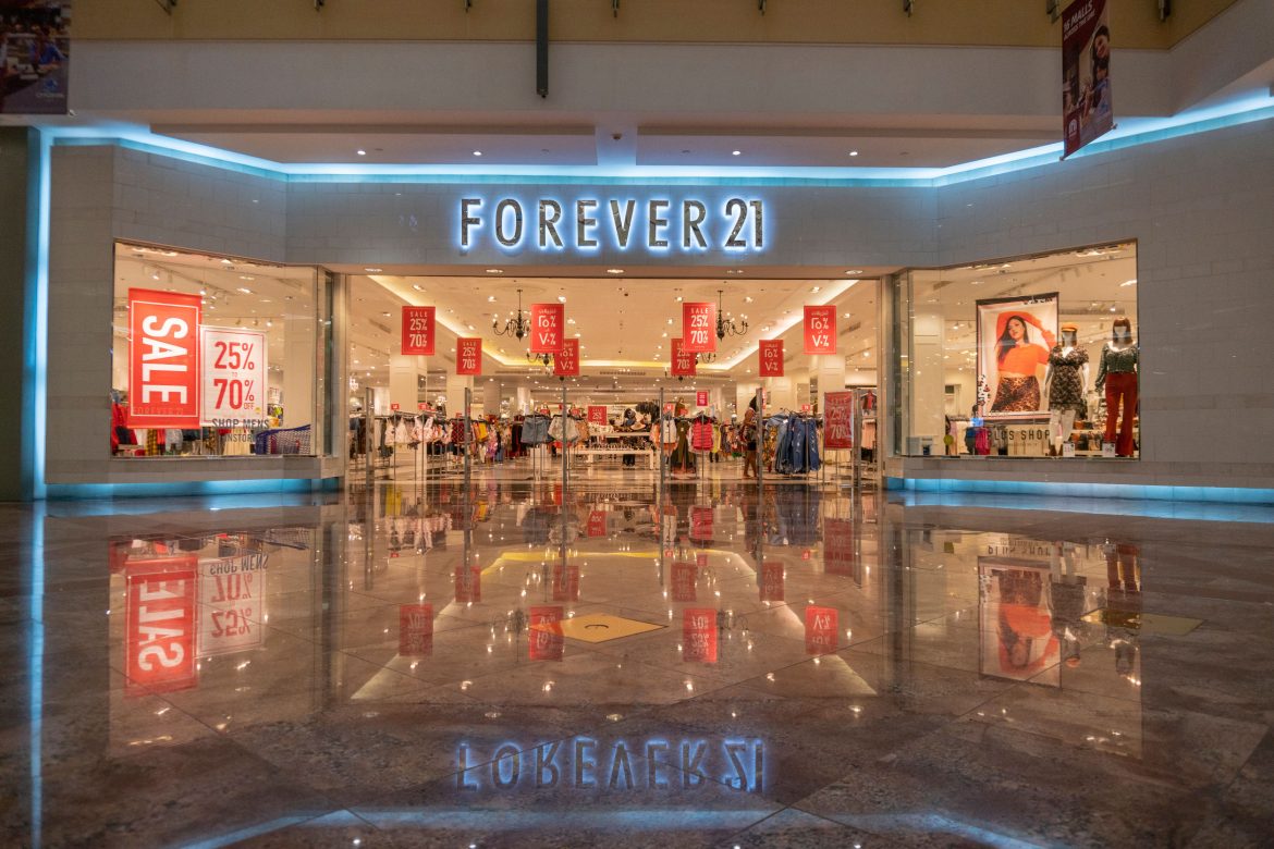 Forever 21’s US operating company, F21 OpCo, has filed for Chapter 11 bankruptcy for the second time in six years, citing declining mall traffic and mounting competition from online retailers. While F21 OpCo operates Forever 21’s US locations and holds the brand’s license in the country, its international stores remain unaffected as they are operated by independent licensees. The filing, made in the US Bankruptcy Court in Delaware on Sunday, signals a likely liquidation of its US operations, as the company has been unable to find a buyer for its approximately 350 domestic stores.The company announced that it will conduct liquidation sales at its physical stores while also engaging in a court-supervised sale and marketing process for some or all of its assets.What bankrupted Forever 21 in the US?Chief Financial Officer Brad Sell pointed to intense competition from foreign fast-fashion companies that have leveraged the de minimis exemption—allowing duty-free imports of lower-cost clothing—to undercut Forever 21’s pricing and margins. He also cited rising costs and broader economic challenges that have impacted consumer demand.Forever 21 previously filed for Chapter 11 in 2019 before being acquired out of bankruptcy by Sparc, a joint venture between Authentic Brands Group (ABG), Simon Property Group, and Brookfield Asset Management. However, despite efforts to revive the brand, the shift in consumer shopping habits away from malls and toward online fast fashion has continued to pressure the business.Forever 21’s estimated assets are listed between $100 million and $500 million, while its liabilities fall between $1 billion and $10 billion, according to its bankruptcy filing. The company also reported having between 10,001 and 25,000 creditors.Forever 21’s futureIf a successful sale of assets occurs, Forever 21 may reconsider a complete wind-down of its operations in favor of a going-concern transaction. For now, the company has assured that its US stores and website will remain operational while liquidation and sale proceedings take place.The filing comes just weeks after Forever 21’s parent company, Sparc Group, merged with JCPenney to form Catalyst Brands. At the time of the merger, Catalyst Brands had indicated that it was “exploring strategic options” for Forever 21, but no clear turnaround path emerged.Although F21 OpCo is headed for liquidation, the Forever 21 brand itself could survive in some form. Authentic Brands, which retains ownership of the trademark and intellectual property, may look to license the name to other retailers. However, ABG CEO Jamie Salter previously expressed regret over acquiring Forever 21, calling it “the biggest mistake I made.”Founded in Los Angeles in 1984 by South Korean immigrants, Forever 21 was once a dominant player in the fast-fashion industry, catering to young shoppers seeking trendy and affordable clothing. At its peak in 2016, the company operated around 800 stores worldwide, including 500 in the US. However, changing retail dynamics and increasing competition from online players have eroded its market position, ultimately leading to its second bankruptcy in less than a decade.The post <a href="https://invezz.com/news/2025/03/17/forever-21-files-for-bankruptcy-in-the-us-what-went-wrong/">Forever 21 files for bankruptcy in the US: what went wrong?</a> appeared first on <a href="https://invezz.com/">Invezz</a> Forever 21 files for bankruptcy in the US: what went wrong?