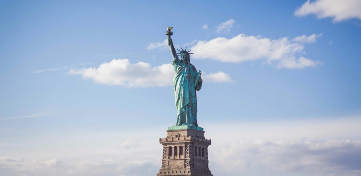 A growing number of international tourists are cancelling or reconsidering travel to the United States, citing a hostile political climate, new visa restrictions, and concerns over arbitrary detentions at immigration checkpoints, <a href="https://www.nytimes.com/2025/03/26/travel/foreign-travel-to-united-states-trump.html">a report by The New York Times</a> has said.The trend comes as the Trump administration moves forward with policies that some foreign officials see as destabilizing trade and diplomatic relations. A proposed travel ban, which could restrict citizens from up to 43 countries—including Belarus, Cambodia, and St. Lucia—has further fuelled unease among potential visitors.“So many Americans are looking to escape the tense and toxic atmosphere at home. Why would anyone want to visit, especially right now with all the arbitrary detentions at immigration?” said Mallory Henderson, 53, a marketing consultant in London who usually visits the United States twice a year, but cancelled a trip to visit her brother and niece in Boston this Easter.Economic impact of declining tourismThe US travel industry, already struggling to recover from the pandemic, faces renewed difficulties.Even before the change in administration, challenges such as a strong dollar and prolonged visa wait times had kept inbound visitor numbers below pre-pandemic levels. According to the US Travel Association, foreign visitor spending is now not projected to fully recover until 2026, a target that may become harder to achieve given the latest policy developments.Travel experts and research firms are adjusting their forecasts downward. Tourism Economics, which had initially projected a 9% rise in inbound travel this year, revised its estimate in February, now predicting a 5.1% decline. The downturn equates to an estimated $18 billion loss in travel spending, with Canada leading the drop following new US tariffs. Canadian travel to the US fell 24% year-over-year in February, forcing airlines such as United and Delta to cut route frequencies.“The negative sentiment shift is anticipated to be sustained by an evolving mix of Trump administration factors, including geopolitical friction on trade and national security policies, charged rhetoric and adversarial posturing,” said Adam Sacks, the president of Tourism Economics.Some airlines have already lowered financial forecasts for the year, pointing to decreased demand. American Airlines and Delta, among others, have acknowledged weaker travel spending, with reductions in flights to Canadian destinations reflecting a broader uncertainty in the travel sector.Canada, Germany, and the UK issue travel advisories for the USIn response to border security crackdowns and heightened immigration enforcement, several governments, including the UK, Germany, and Canada, have updated their travel advisories for the United States. Foreign visitors have been warned that holding a valid visa or qualifying for a visa waiver does not guarantee entry, and detentions at US ports of entry have increased.Recent incidents, such as the reported refusal of a French scientist at the US border after officials searched his phone for critical opinions about the Trump administration, have added to the concerns. While US authorities have denied any political motivations behind the decision, the case has fuelled further apprehensions about the unpredictability of US immigration policies.European travellers too rethink plans on Trump’s “sabotage”Though Canada has been the hardest hit market, European travellers are also rethinking their plans. Preliminary data from the US National Travel and Tourism Office shows a 1% decline in Western European arrivals in February, a sharp contrast from the 14% increase recorded in the same period last year. Travel operators in Europe note that while mass cancellations have not yet occurred, interest in alternative destinations is rising.For some, the decision to cancel US trips is not just about policy but also about principle. Christoph Bartel, a German resident of Norway, had planned a summer trip to Arizona’s national parks but cancelled following the Trump administration’s decision to fire national park employees and roll back environmental protections.“It does not feel right to support the American economy when the president is causing so much sabotage,” said Bartel. “We will go to Canada or Mexico instead.”Britain, another major source of visitors to the US, is also seeing a split in travel behaviour. Some frequent travellers remain undeterred, while others actively seek alternatives. Alan Wilson, managing director of the UK-based Bon Voyage Travel & Tours, noted a 5% drop in US bookings this year. Cost factors, including high hotel prices and tipping expectations, further deter British tourists.“British travellers absolutely hate the 20% tipping culture and how America always has its hand out for the next gratuity,” Wilson said. “They would rather pay the money upfront.”US tourism hubs brace for slowdownIn major destinations like New York, California, and Florida, small travel businesses are already feeling the effects. Luke Miller, owner of Real New York Tours, reported widespread cancellations, particularly from Canadian visitors.“I just had 20 busloads of seniors cancel their upcoming tours. That’s thousands of dollars in losses for my small business,” said Miller, who has seen bookings decline as far ahead as the winter holiday season.Recognizing the challenge, tourism boards in New York and California have ramped up marketing efforts to reassure global visitors. Visit California revised its 2025 visitor spending projections downward to $160 billion from $166 billion, factoring in the slowdown in international arrivals and the impact of January’s wildfires.Caroline Beteta, president of Visit California, emphasized the state’s continued appeal, saying, “Thanks to California’s strong brand on the global stage, international visitors continue to show a strong affinity for the Golden State.”New York City, facing similar headwinds, is promoting budget-friendly travel to encourage more visitors. “This is an excellent opportunity to highlight other boroughs beyond Manhattan that offer award-winning culinary, arts, and cultural experiences,” said Julie Coker, president of New York City Tourism + Conventions.Despite these efforts, many in the industry remain wary. Miller of Real New York Tours fears that without a rebound in bookings, his business may not survive the downturn. “The reality is that we are being hit the hardest and might not survive,” he said.The post <a href="https://invezz.com/news/2025/03/26/how-trumps-policies-are-sparking-a-drop-in-international-travel-to-the-us/">Turning away: how Trump’s policies are sparking a drop in international travel to the US</a> appeared first on <a href="https://invezz.com/">Invezz</a> Turning away: how Trump’s policies are sparking a drop in international travel to the US